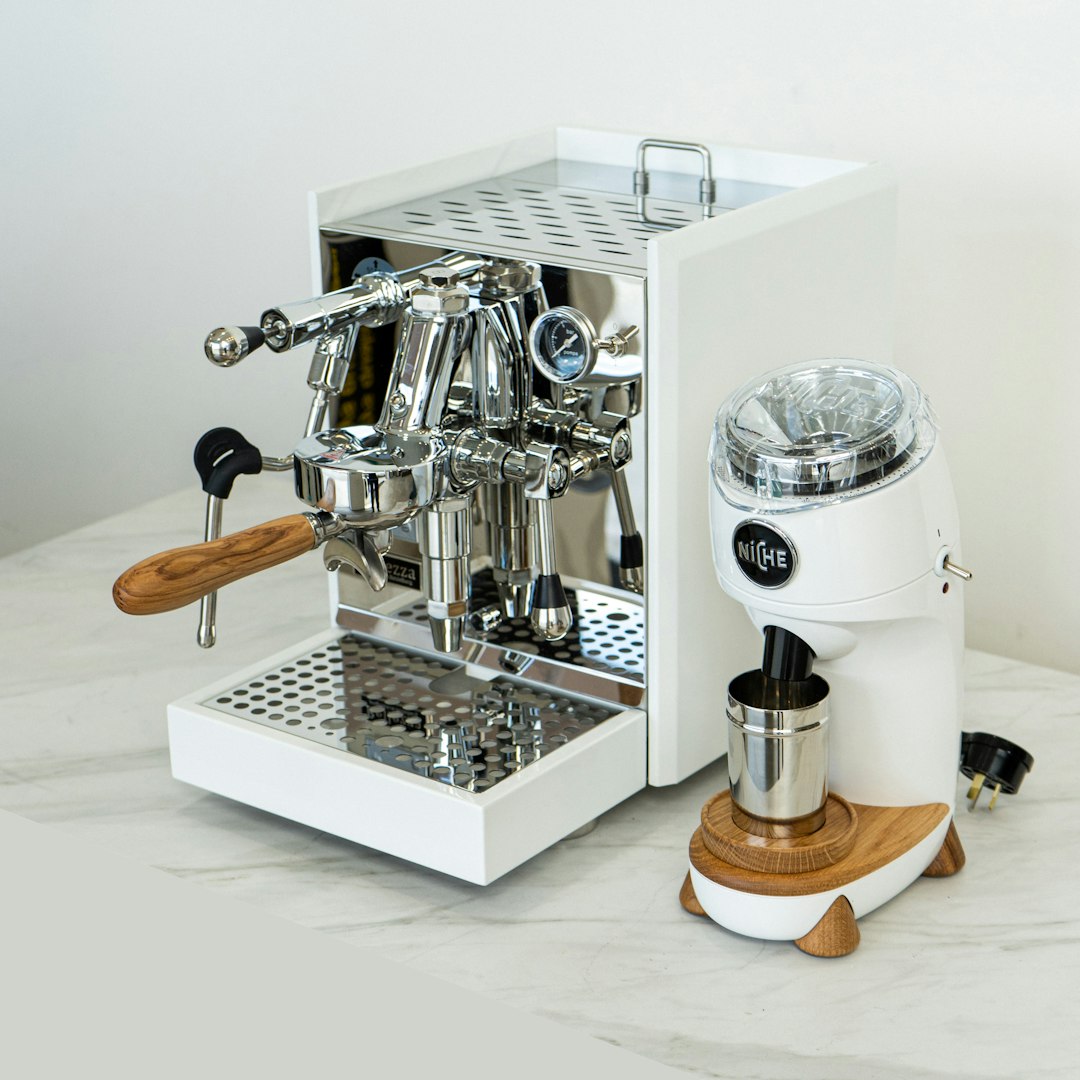 Espresso machine with a built-in grinder on a white kitchen counter