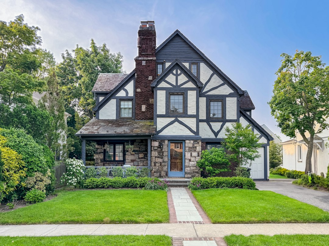 Stone and timber house exterior, illustrative stock photo