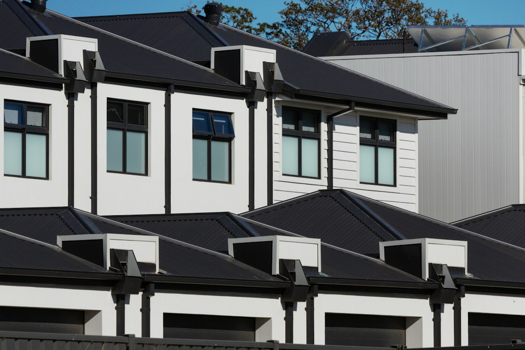 Row of newly built townhouses with a construction site in the foreground