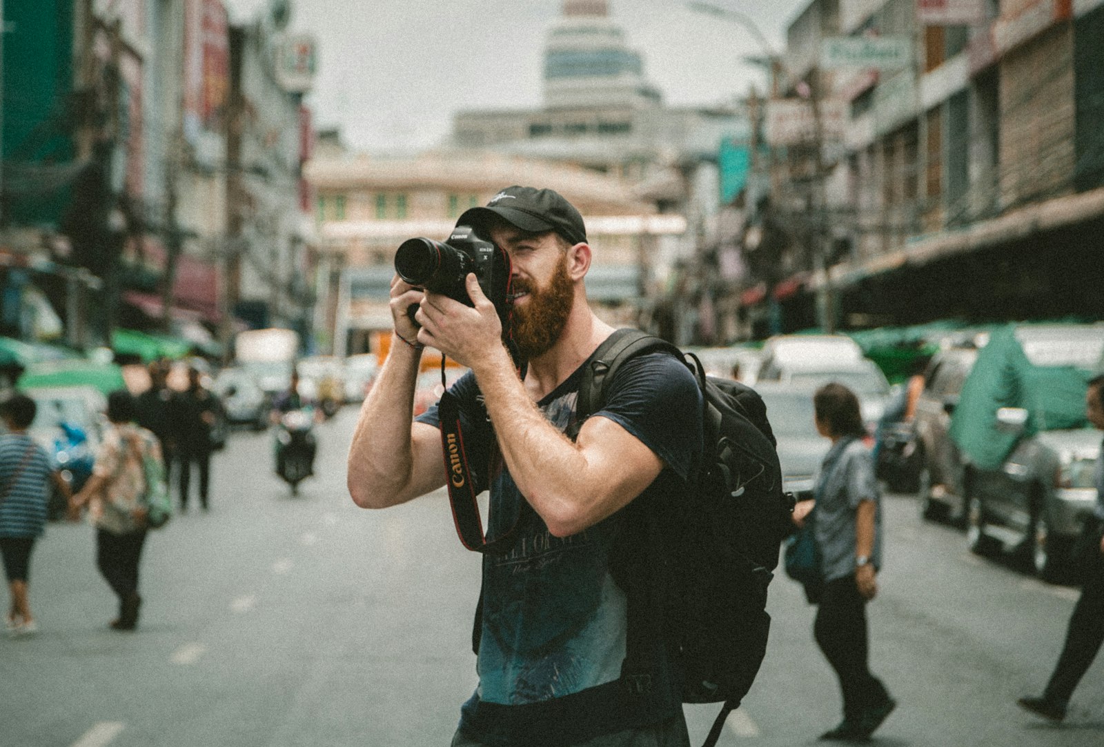 Photographer shooting with a camera in a natural landscape