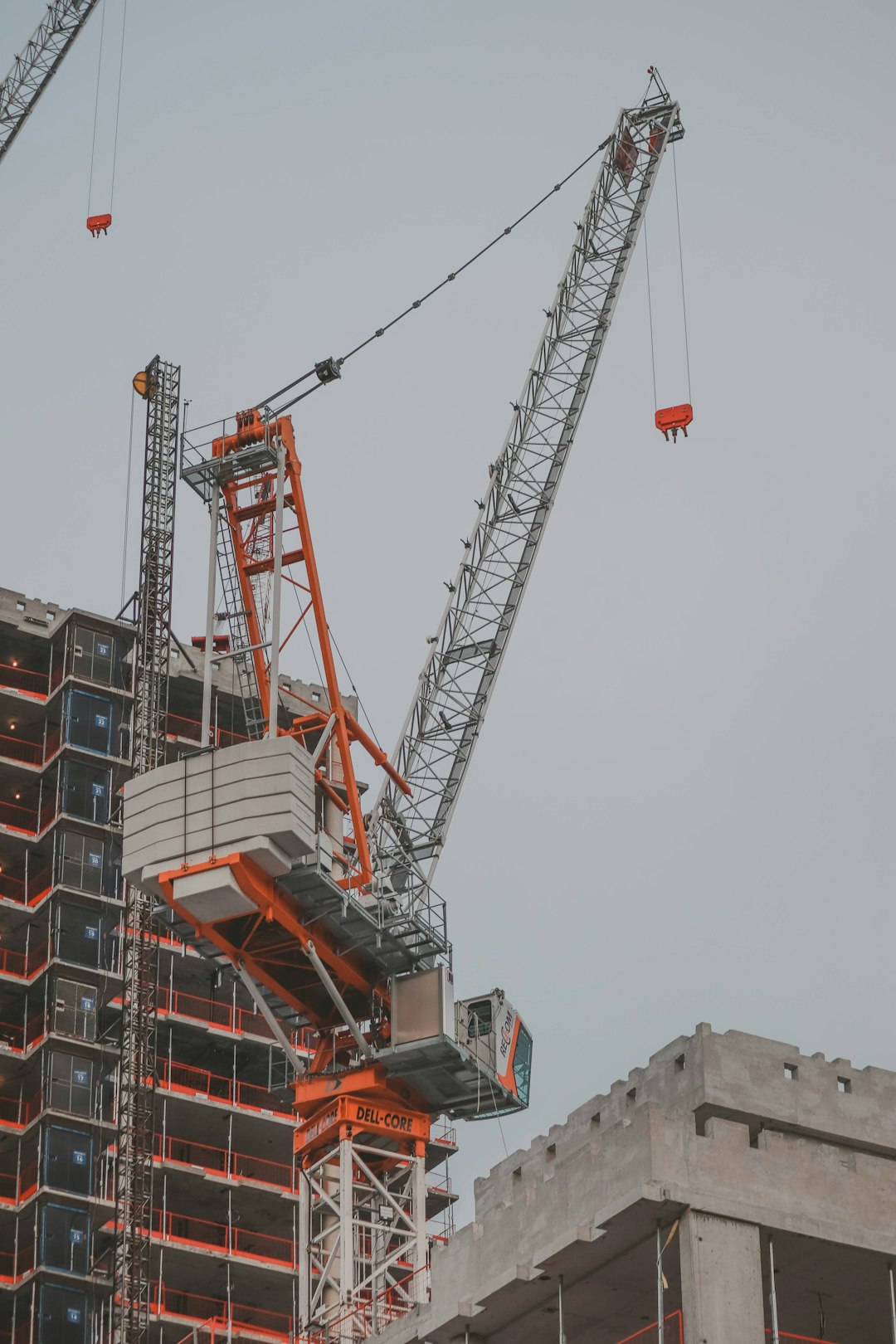 A tower crane above a residential building under construction in Toronto