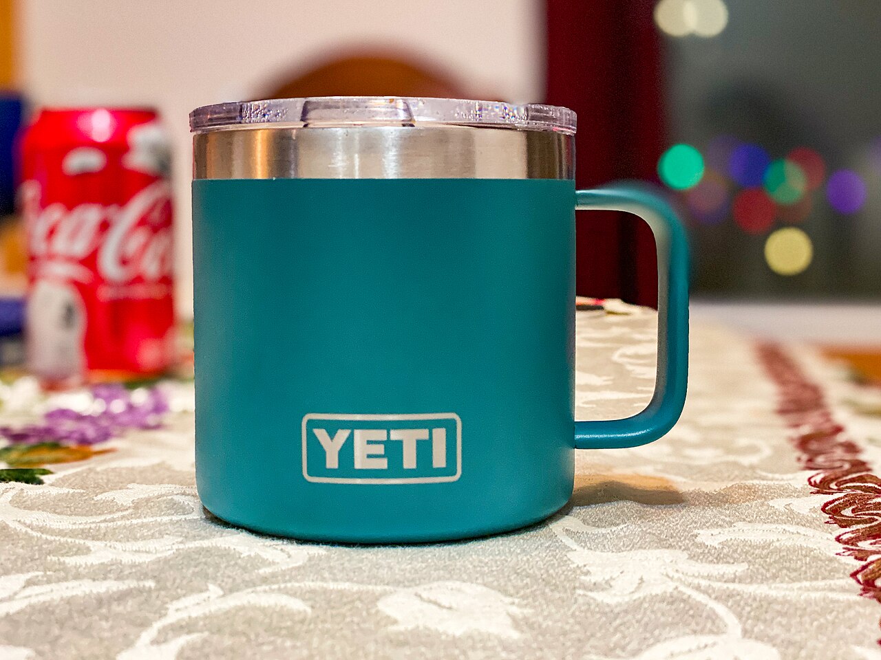 A teal YETI Rambler insulated mug