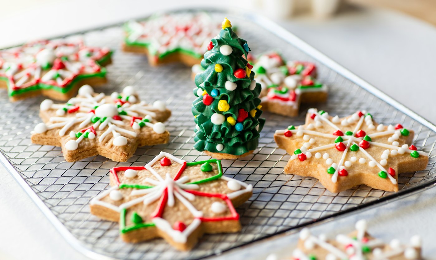 Tray of decorated Christmas cookies on a table