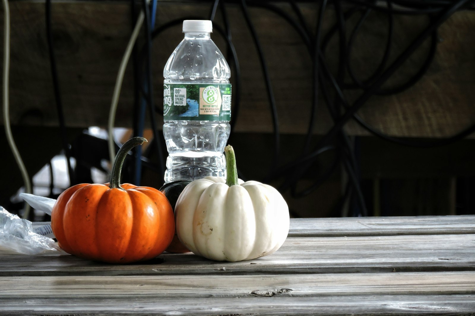 Reusable water bottle on a table next to fruit