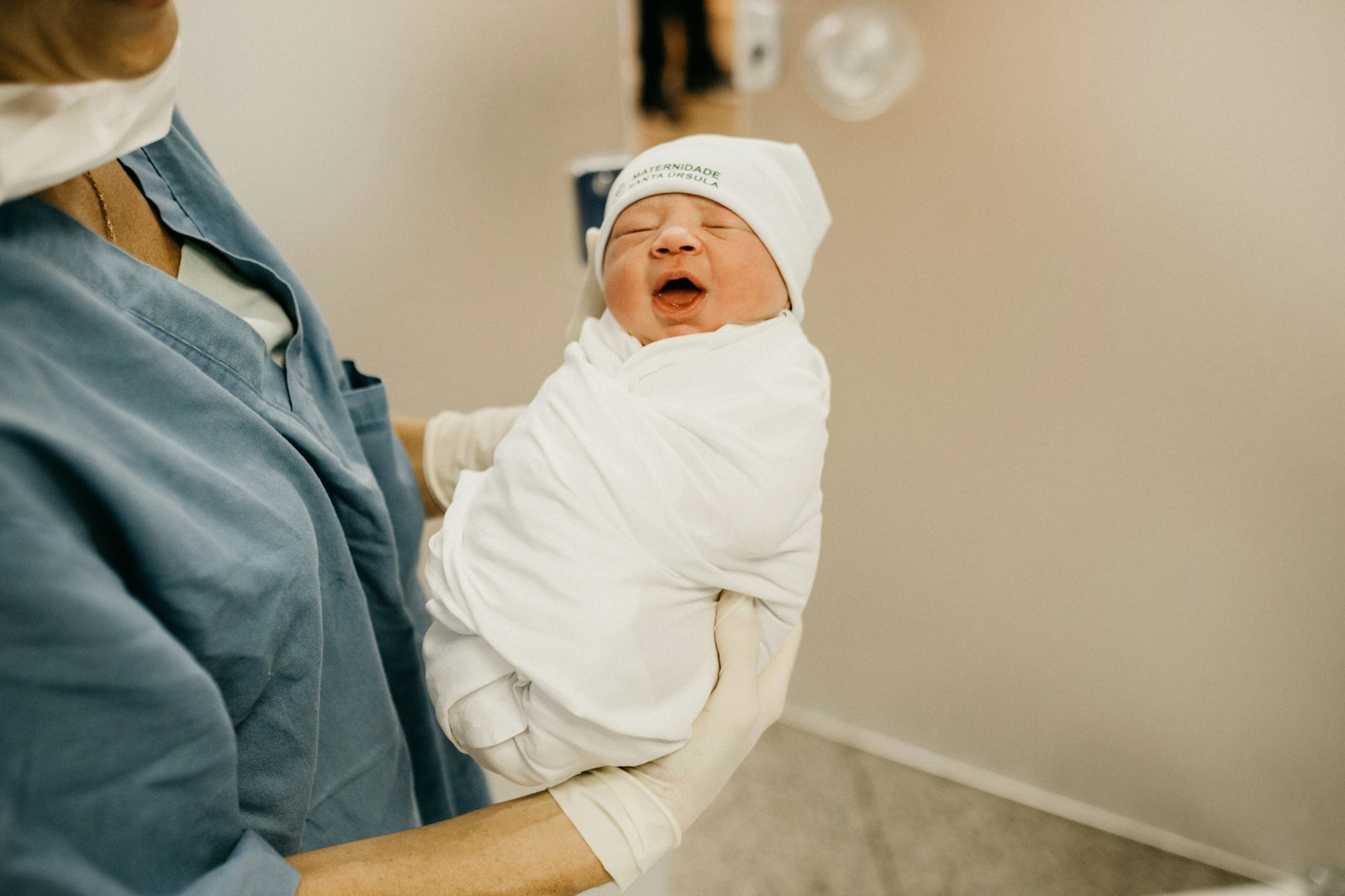Woman carrying a baby in her arms