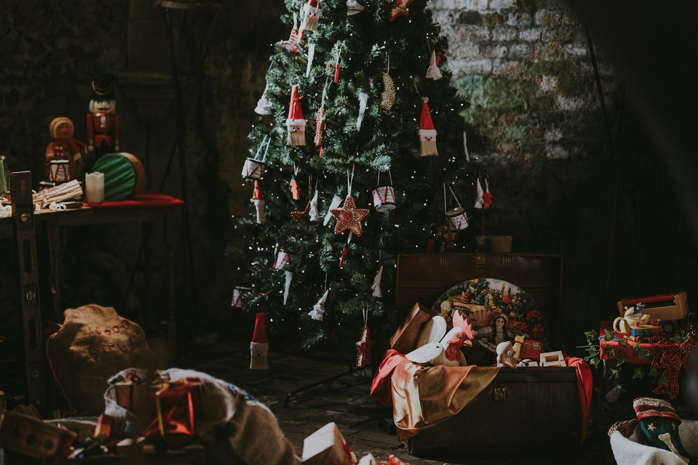 Christmas tree with wrapped gifts in a festive room