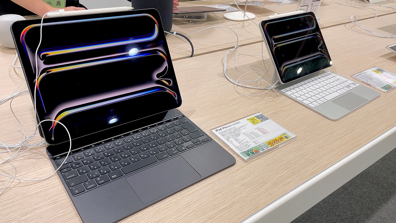 13-inch iPad Pro with Magic Keyboard next to an 11-inch iPad Pro on a store display