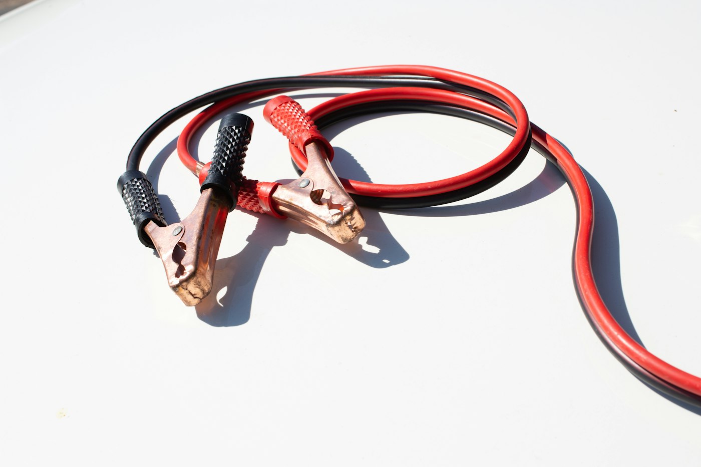 Red and black jumper cables, a standard item in a winter car emergency kit