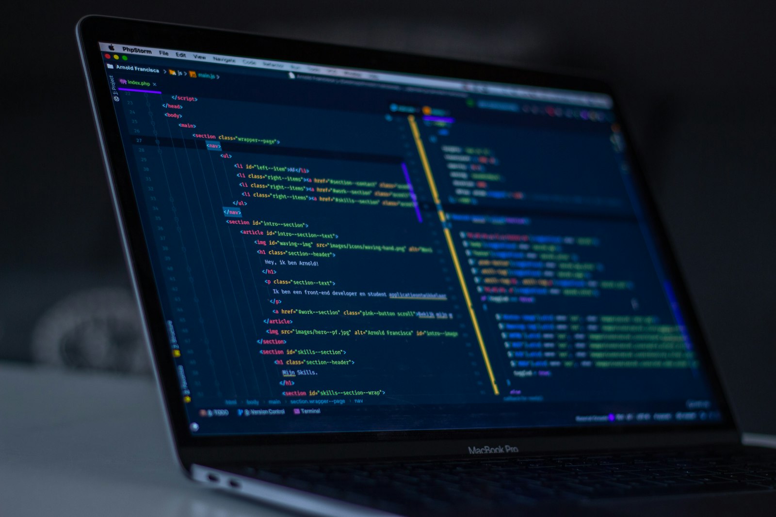 MacBook Pro screen showing lines of programming code