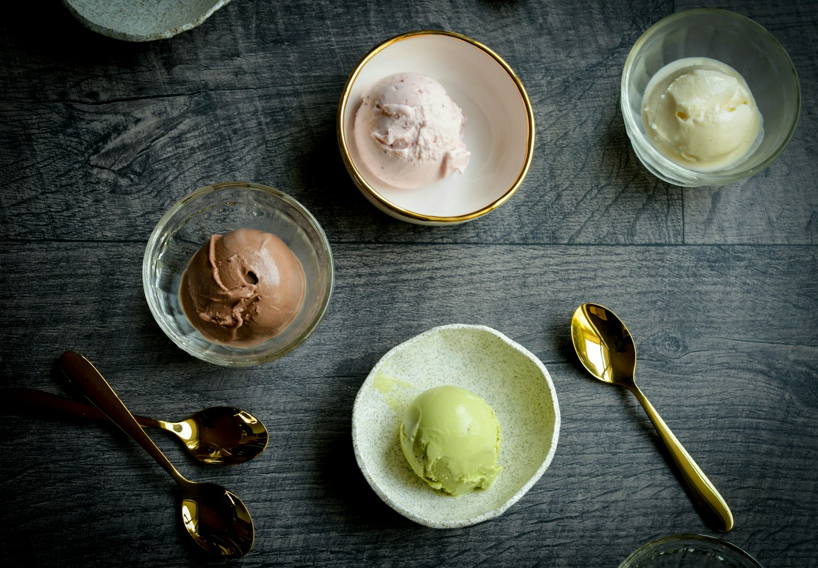 Small bowls of ice cream in several flavours, the kind of scoops a Ninja CREAMi turns out at home