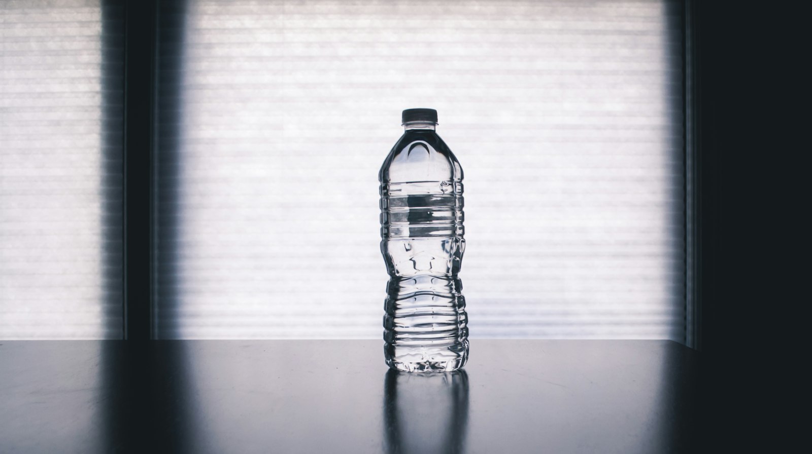 Clear drinking bottle filled with water, similar to a time-marker water bottle