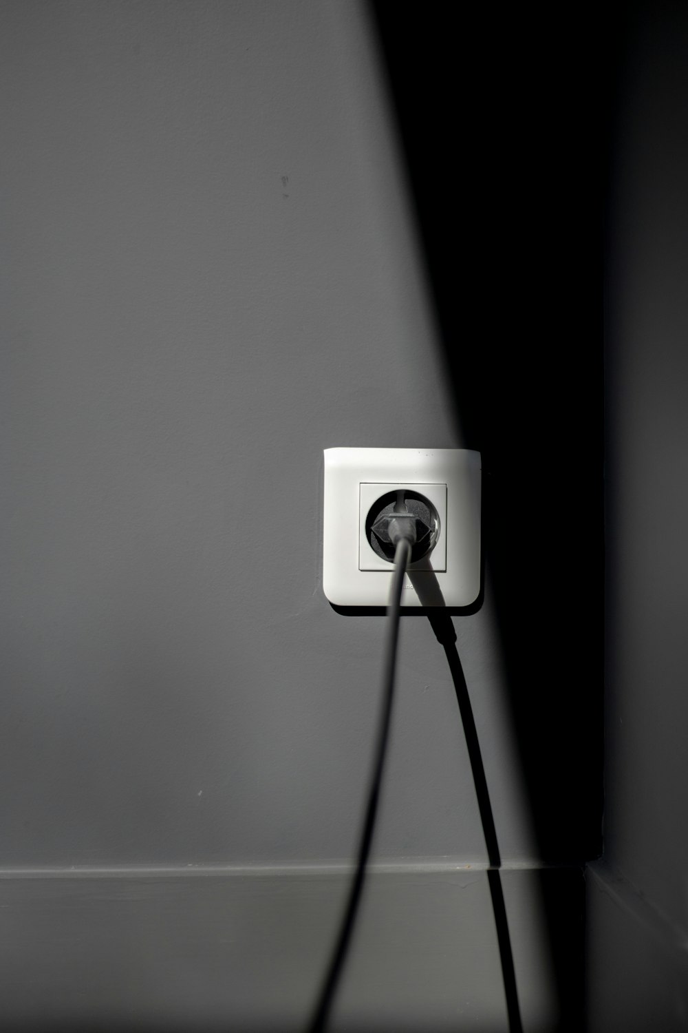 Black and white photo of electrical wall outlets