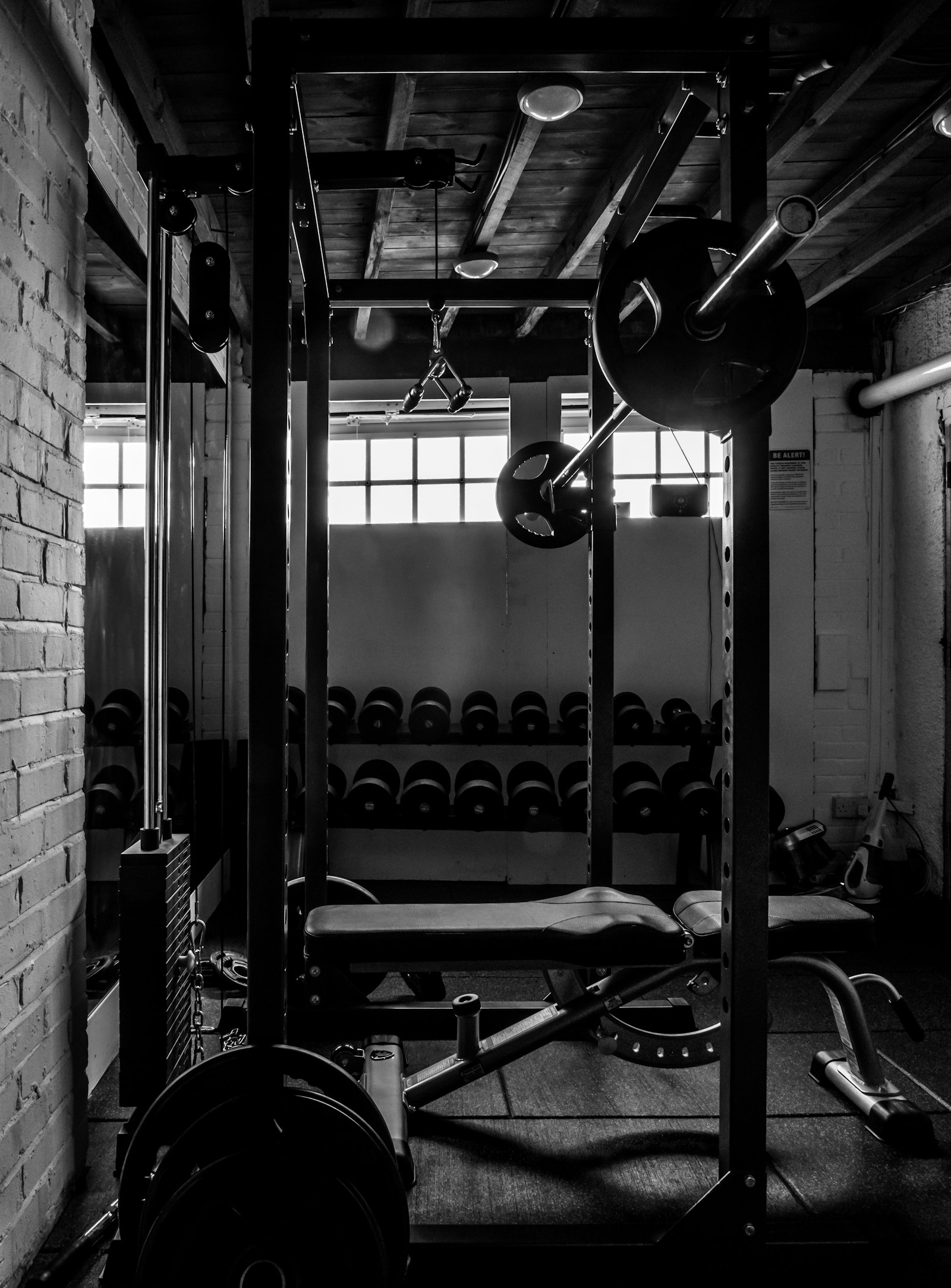 Home gym with weights, a setting where owners keep a massage gun for post-workout recovery