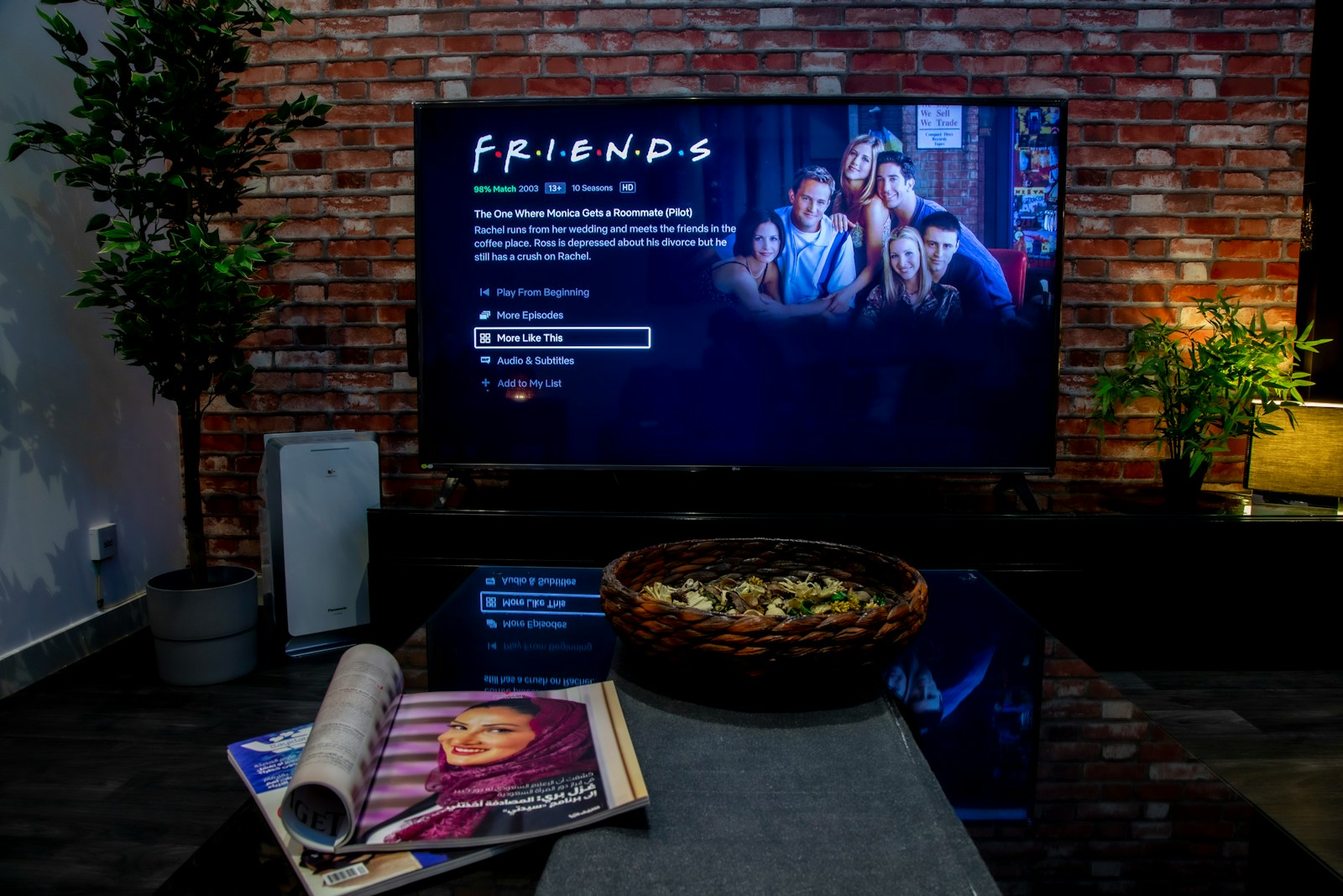 A modern living room with a large sofa and television, the kind of room a soundbar suits
