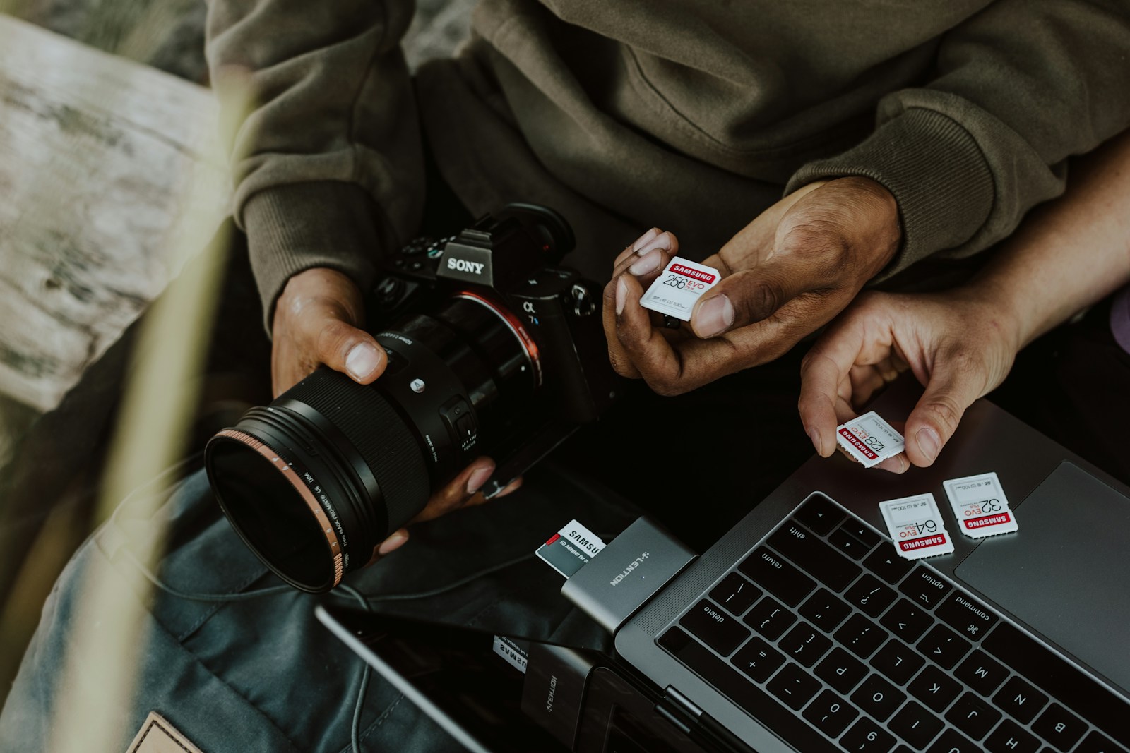 Photographer holding a DSLR camera, a typical user of a rugged portable SSD