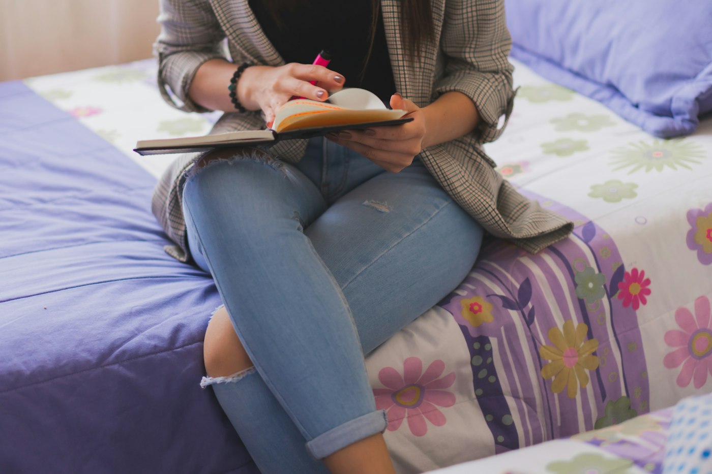 Young woman relaxing at home with a notebook and everyday activities
