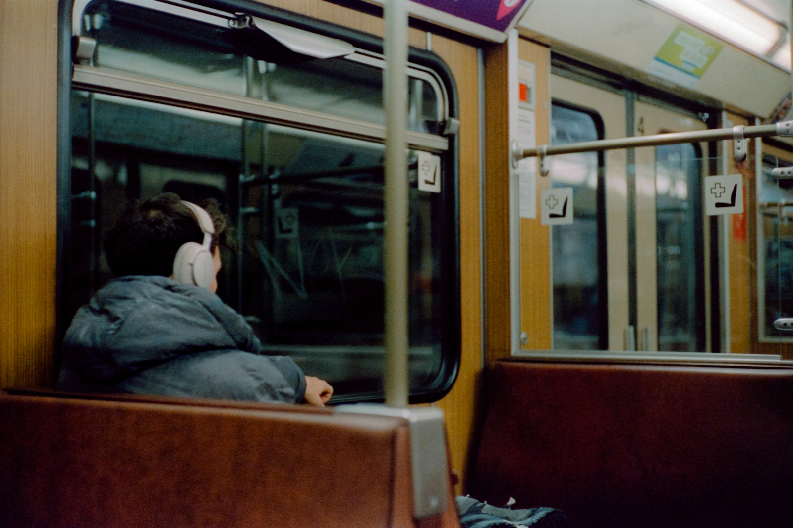 Passenger sitting on a train looking out the window