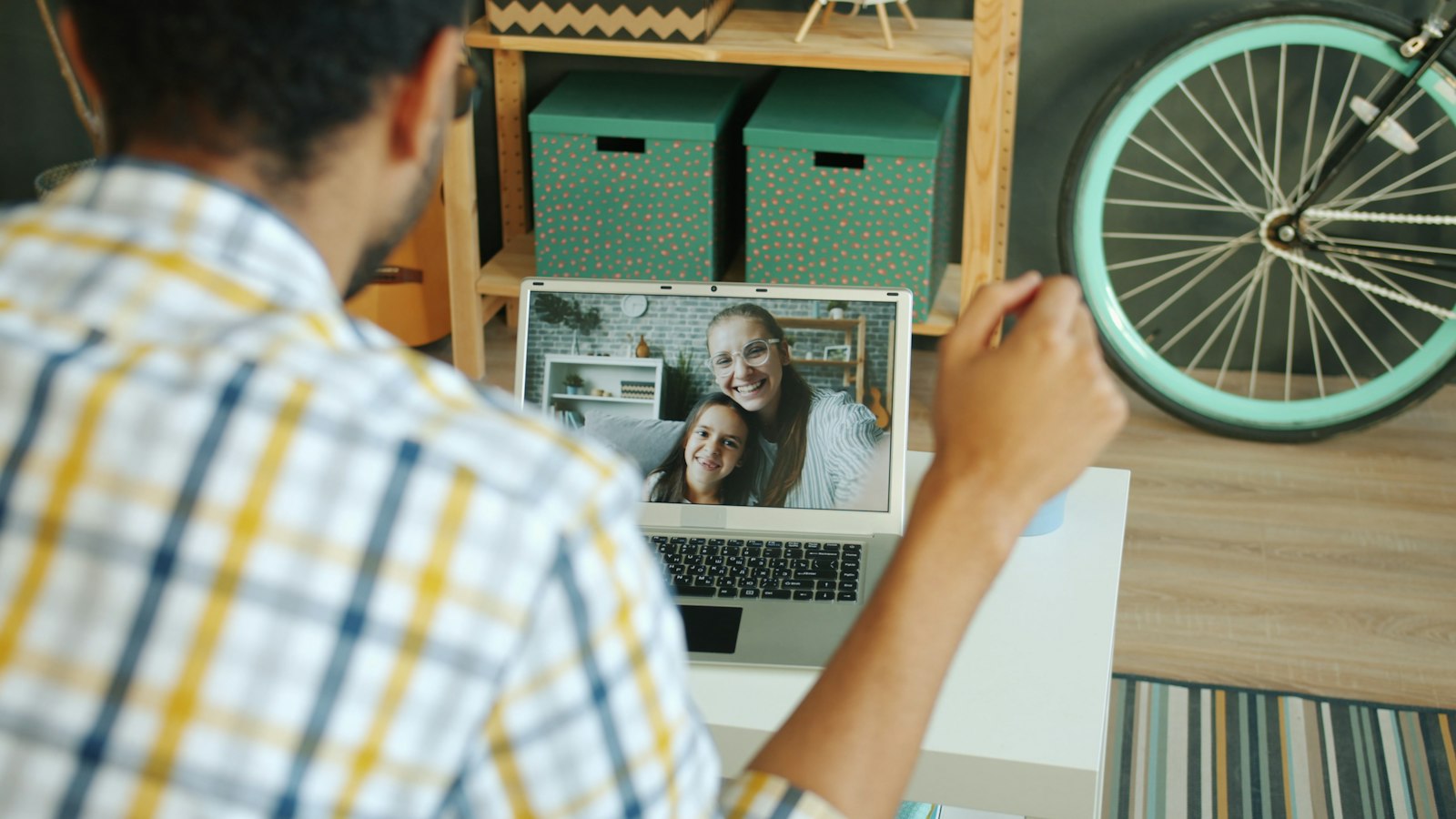 Family on a laptop video call at home